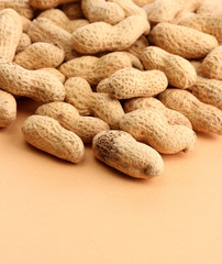 tasty peanuts, on beige background