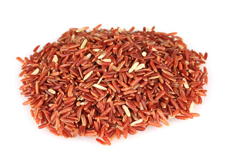 red  rice uncooked in a heap isolated on a white background
