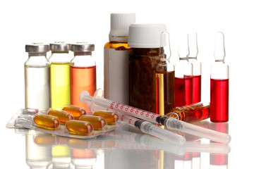 medical ampules, bottles, pills and syringes, isolated on white