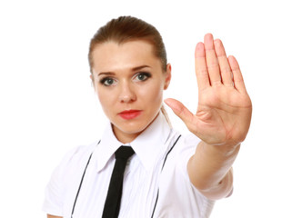 Woman smiling and showing his hand in signal of stop