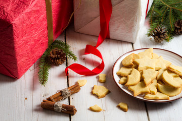 Plate full of Christmas cookies on a gifts background