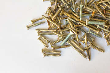 Pile of screws on white background