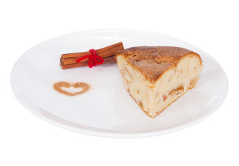 apple pie with cinnamon on white plate