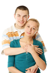 A happy young couple is embracing - on white background