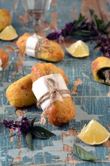 Fried rolls with fish and pesto sauce