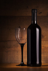 Wine bottle and glass on the table