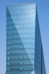 Contemporary office building side, blue glass windows