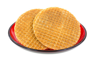 Round honey wafer cookies on plate
