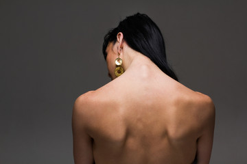 naked back of a beautiful brunette woman