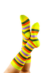 female legs in colorful striped socks