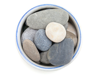 Fototapeta na wymiar beautiful sea stones in a bowl