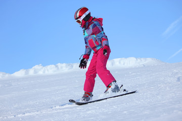 Fototapeta na wymiar Girl skiing
