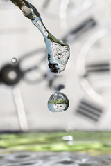 Drops of time. Clocks in drops of water.