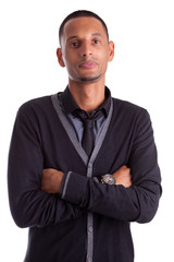 Portrait of a young african american man with folded arms