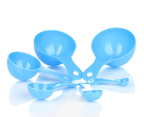 Blue measuring spoons isolated on white