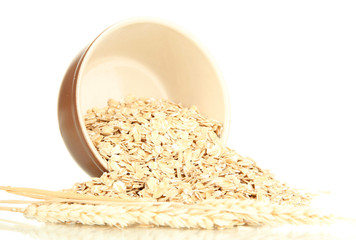 Oat flakes in brown bowl isolated on white