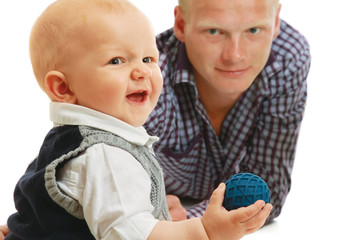 Young father carrying happy baby boy