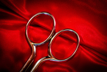 scissors on red fabric