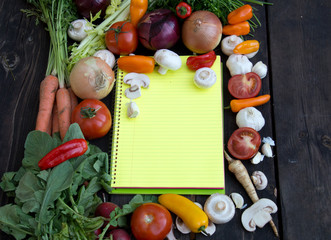 Yellow paper for recipes, tomato, pepers and vegetable