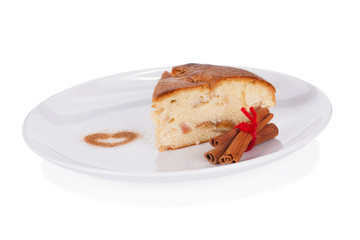apple pie with cinnamon on white plate