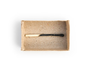 burnt matchstick in a matchbox