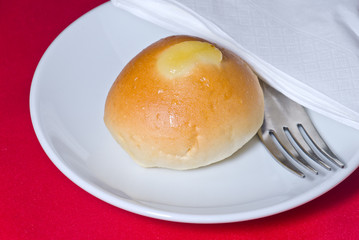 one bread on white plate