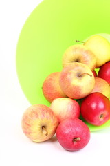 Fresh green, red apples in basket isolated