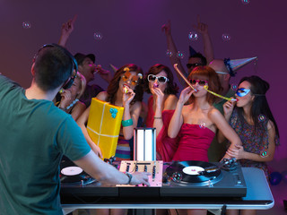 party of young peopple, with dj, present and paty horns