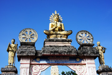 Fototapeta na wymiar Buddha on a temple door and the sky