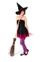 Smiling halloween witch with a broom isolated on the white backg