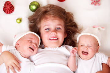 girl and infant twins