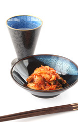 Korean Kimchi and Japanese Sake isolated on white background