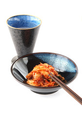 Korean Kimchi and Japanese Sake isolated on white background