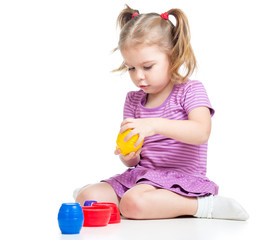 Cute child girl playing with toys isolated over white