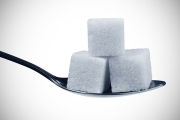 Spoon with sugar cubes