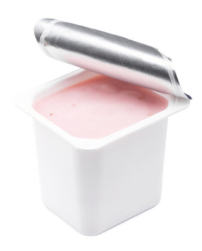 Strawberry yogurt in opened yoghurt pot