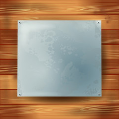 Metal plate on wooden background