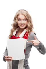 Fototapeta premium young smiling woman pointing at sign