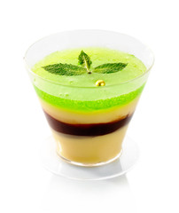 Fresh fruit jelly with green mint isolated