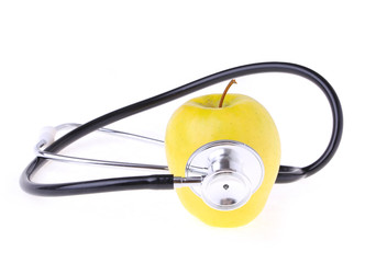 stethoscope and yellow apple isolated on white, concept