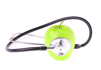 stethoscope and green apple isolated on white