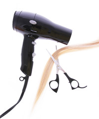 hair dryer, scissors and lock of hair isolated