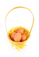 eggs in beautiful basket isolated