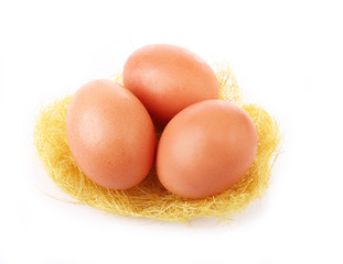 three egg in grassy nest isolated