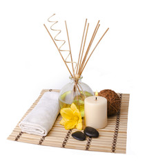 spa setting with aroma sticks, flower and rocks isolated