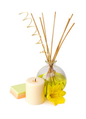spa setting with aroma sticks, candle, and flower isolated