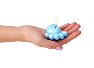 blue candle for baby shower in hands isolated on white