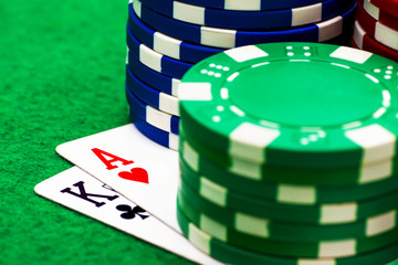 Ace, king and poker chips stack