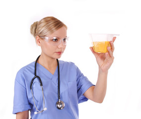 young doctor with stethoscope holding urine sample isolated