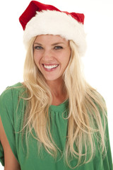 Woman green top santa hat smile